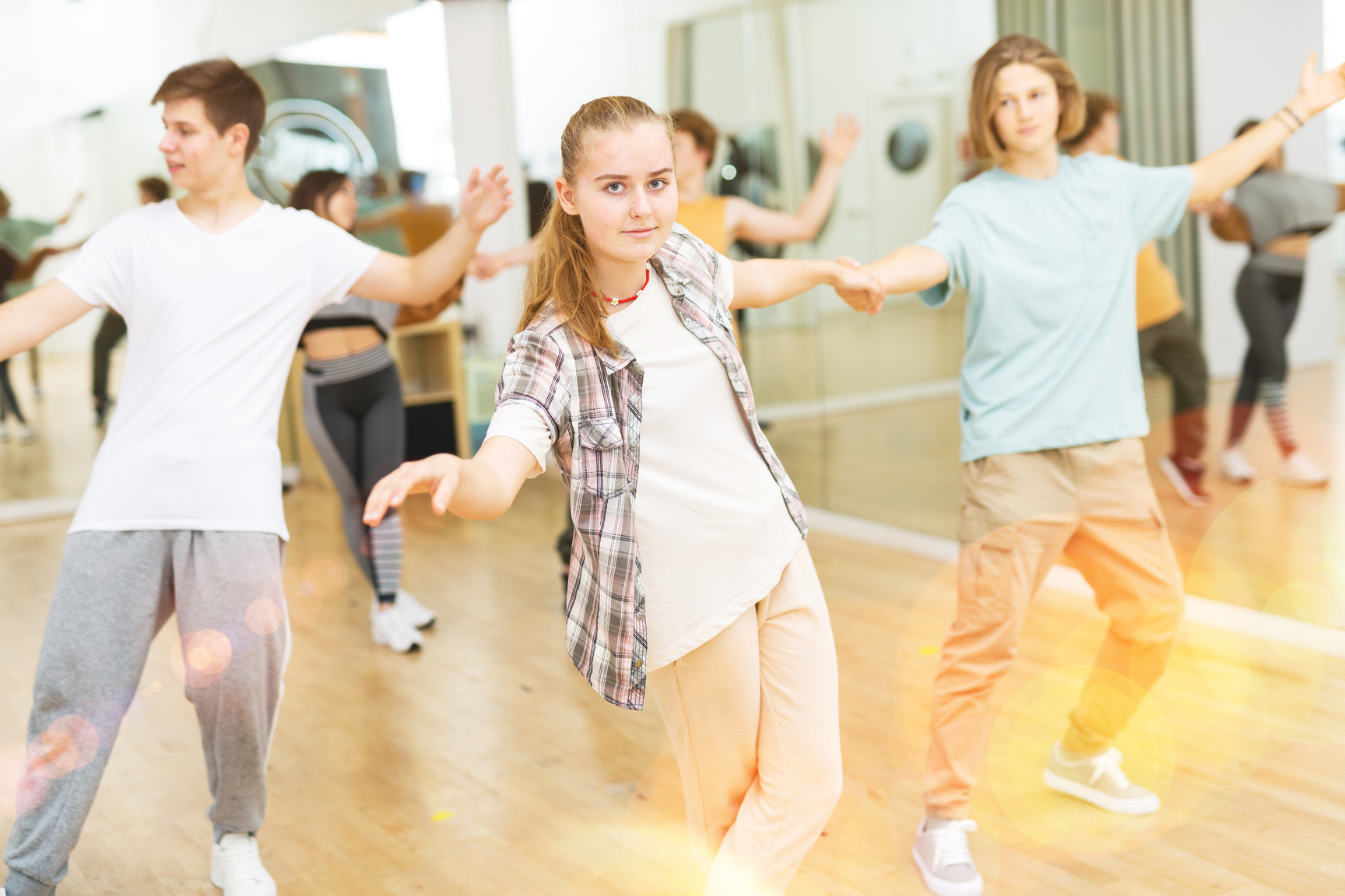 Teenagers dancing salsa in studio